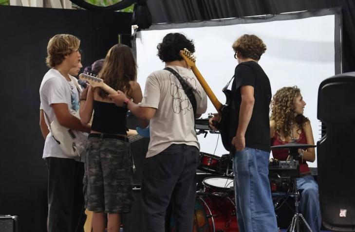Student performing on stage at Nosara Music Academy
